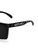 Black sunglasses with 'HOSTILE' branding on a white background