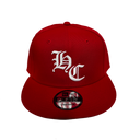 Red snapback hat with white logo